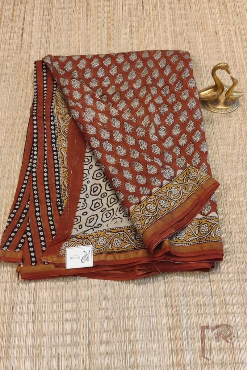 Chanderi Charisma - Rust Chanderi Silk Saree with Black Floral Motifs, Mustard Leaf Border and Cream Abstract Blouse