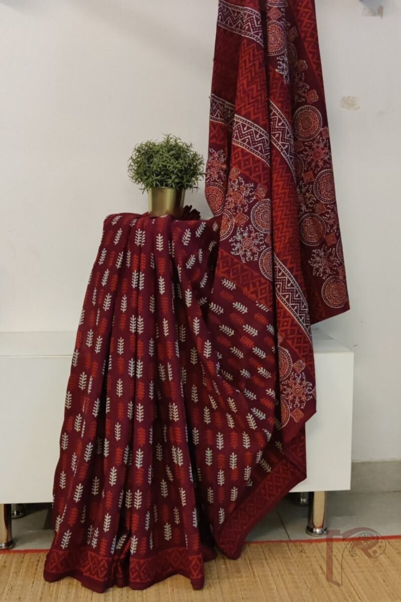 Mulmul Muse – Maroon Mulmul Cotton Saree with Red & Cream Leaf Motifs, Ajrakh-Inspired Pallu, and Red Block Print Border