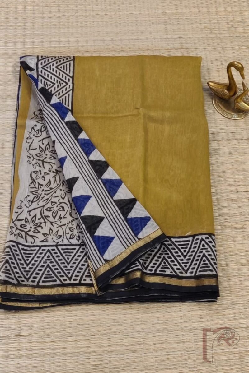 Chanderi Charisma - Mustard Yellow Chanderi Saree with Black Abstract Triangle Border, Blue-Black Printed Pallu, and Cream Floral Blouse