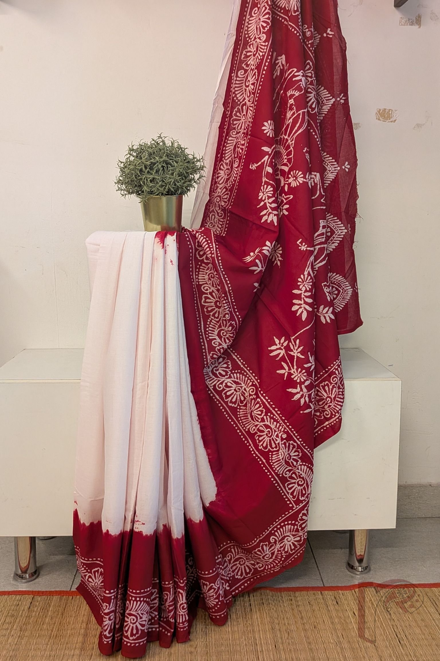 Mulmul Muse – White and Red Hand Batik Mulmul Saree with Human Figure Motif
