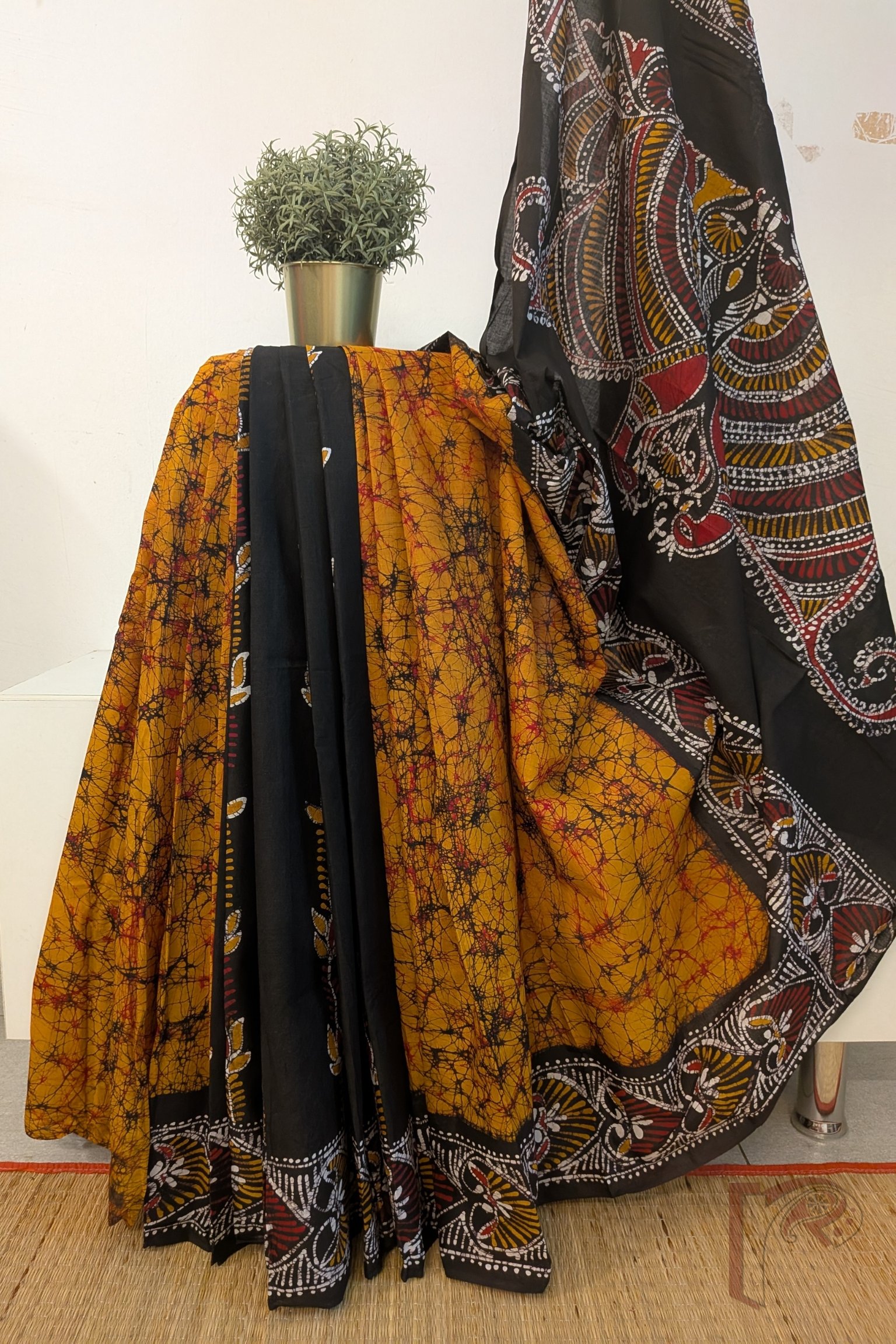 Mulmul Muse – Orange and Black Half & Half Hand Batik Mulmul Saree with Swan and Heart Motifs