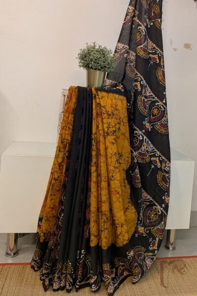 Mulmul Muse – Orange and Black Half & Half Hand Batik Mulmul Saree with Arch and Leaf Motifs