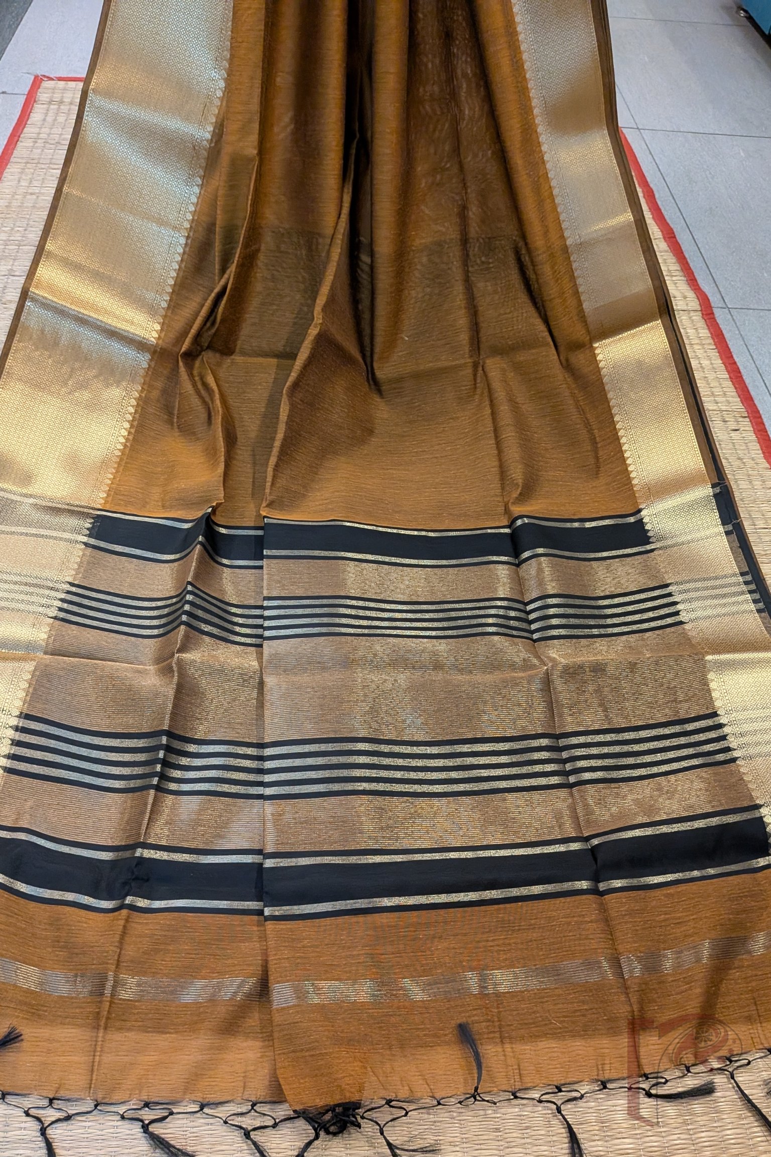 Banarasi Bloom: Mustard Brown Cotton Silk Saree with Dull Gold Border, Gold-Black Stripes and Contrast Black Blouse