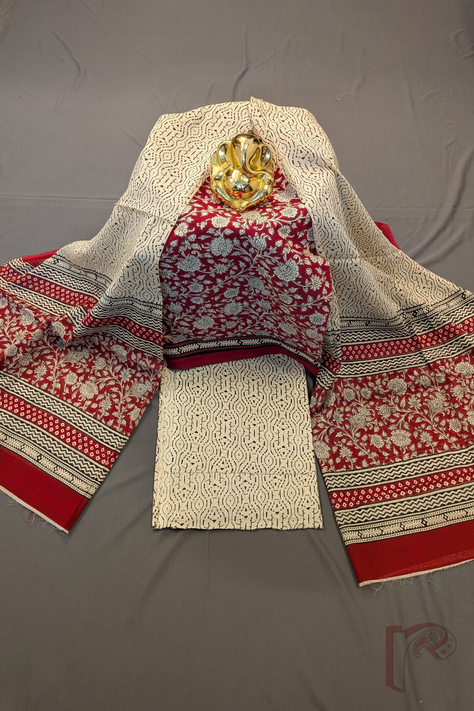 Suit stories - Maroonish Red Kalamkari Floral Mul Cotton Suit Set with Cream & Black Abstract Accents