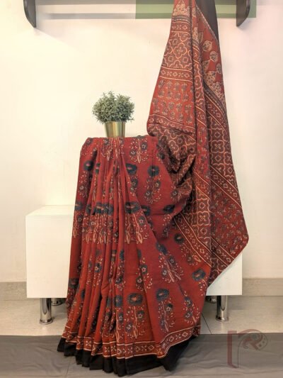 Ajrakh Aura - Rust Orange Cotton Ajrakh Saree with Dahlia Floral Motifs and Geometric Panel Pallu