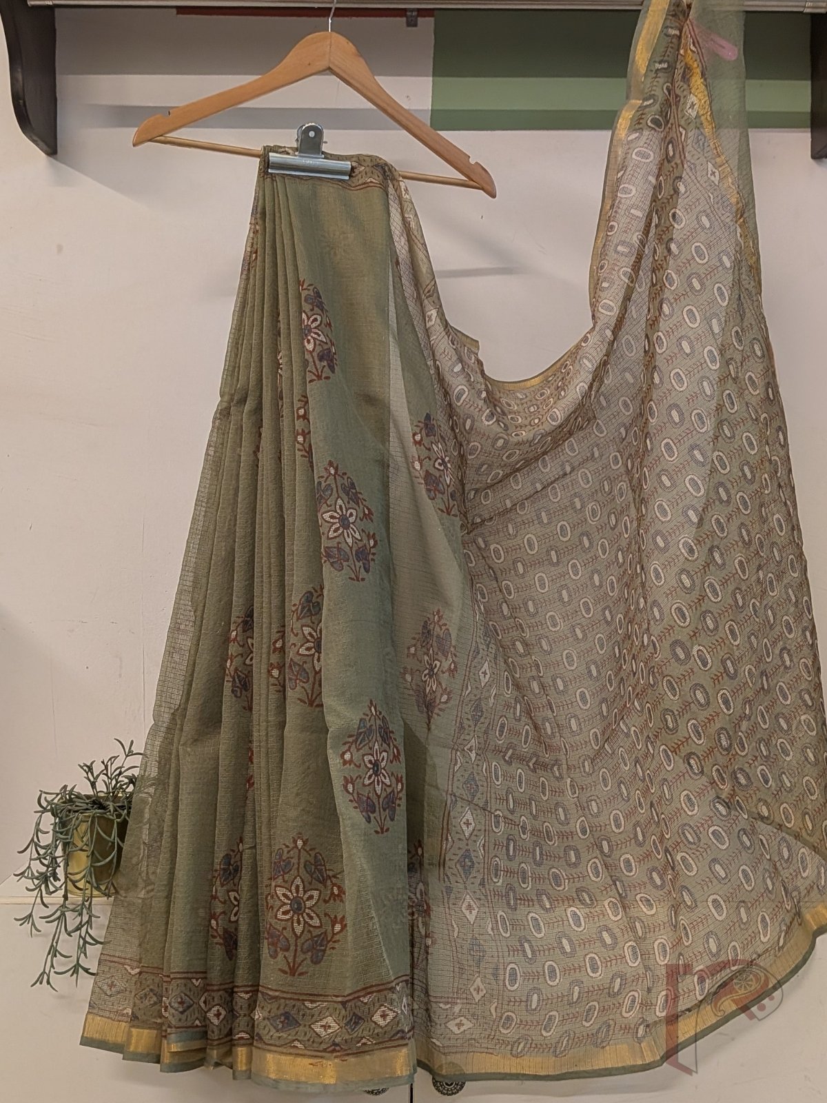 Kota Katha – Sage Green Kota Doria Saree with Rust Indigo Floral Butas and Gold Zari Border