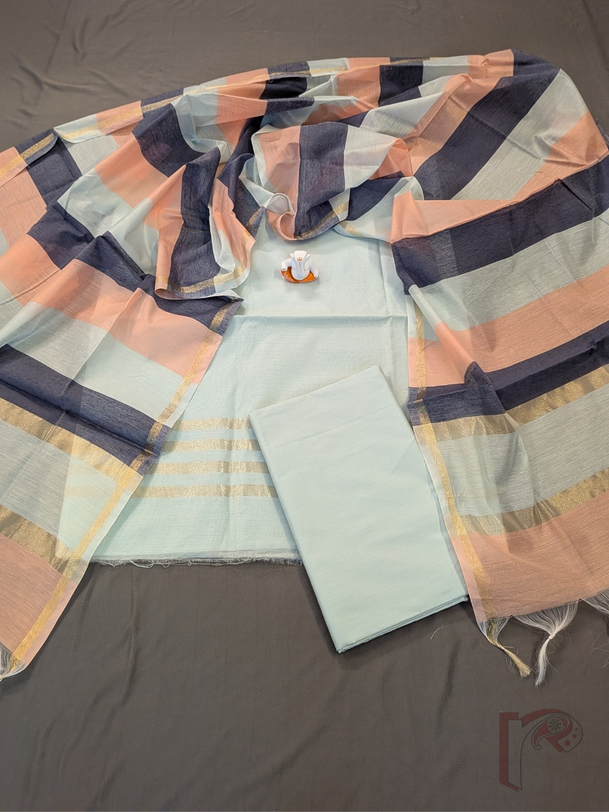 Suit Stories – Light Ocean Blue Suit Material with Parallel Gold Zari Borders