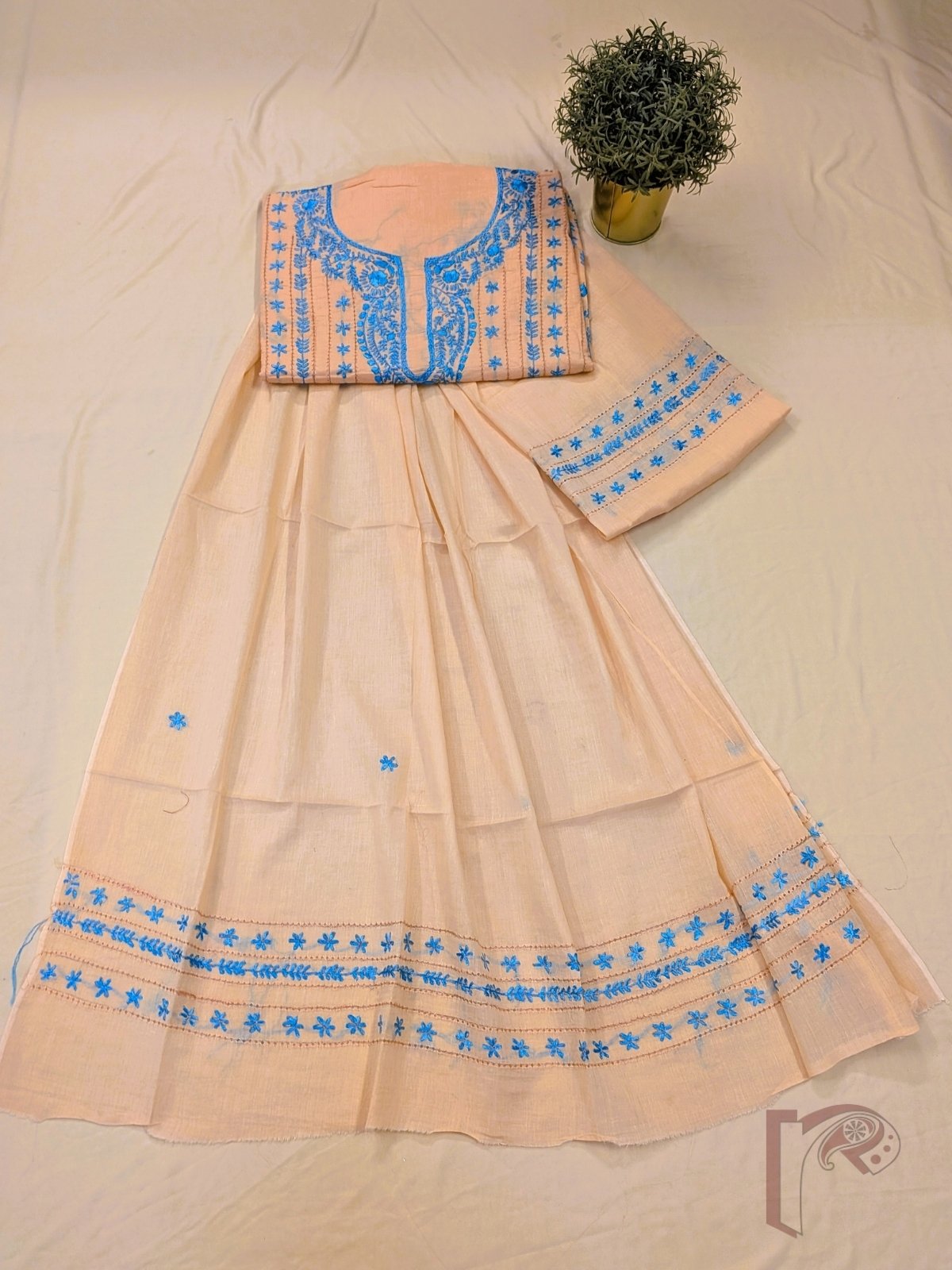 Suit stories - Pastel Peach Orange Flex Cotton Suit Material with Sky Blue Jal Work